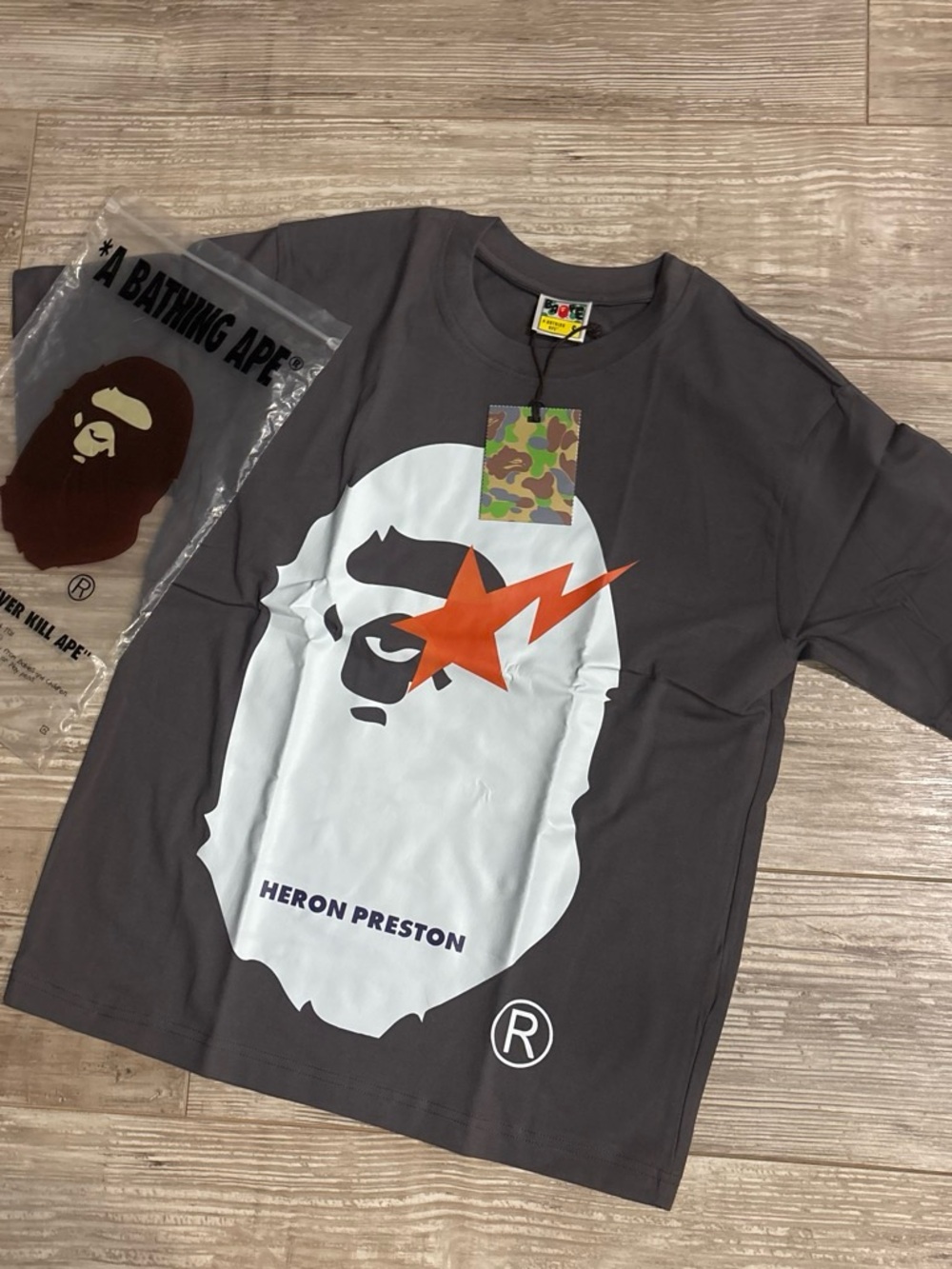 Heron Preston Charcoal Short-Sleeve Tee with White Ape Graphic and Orange Star